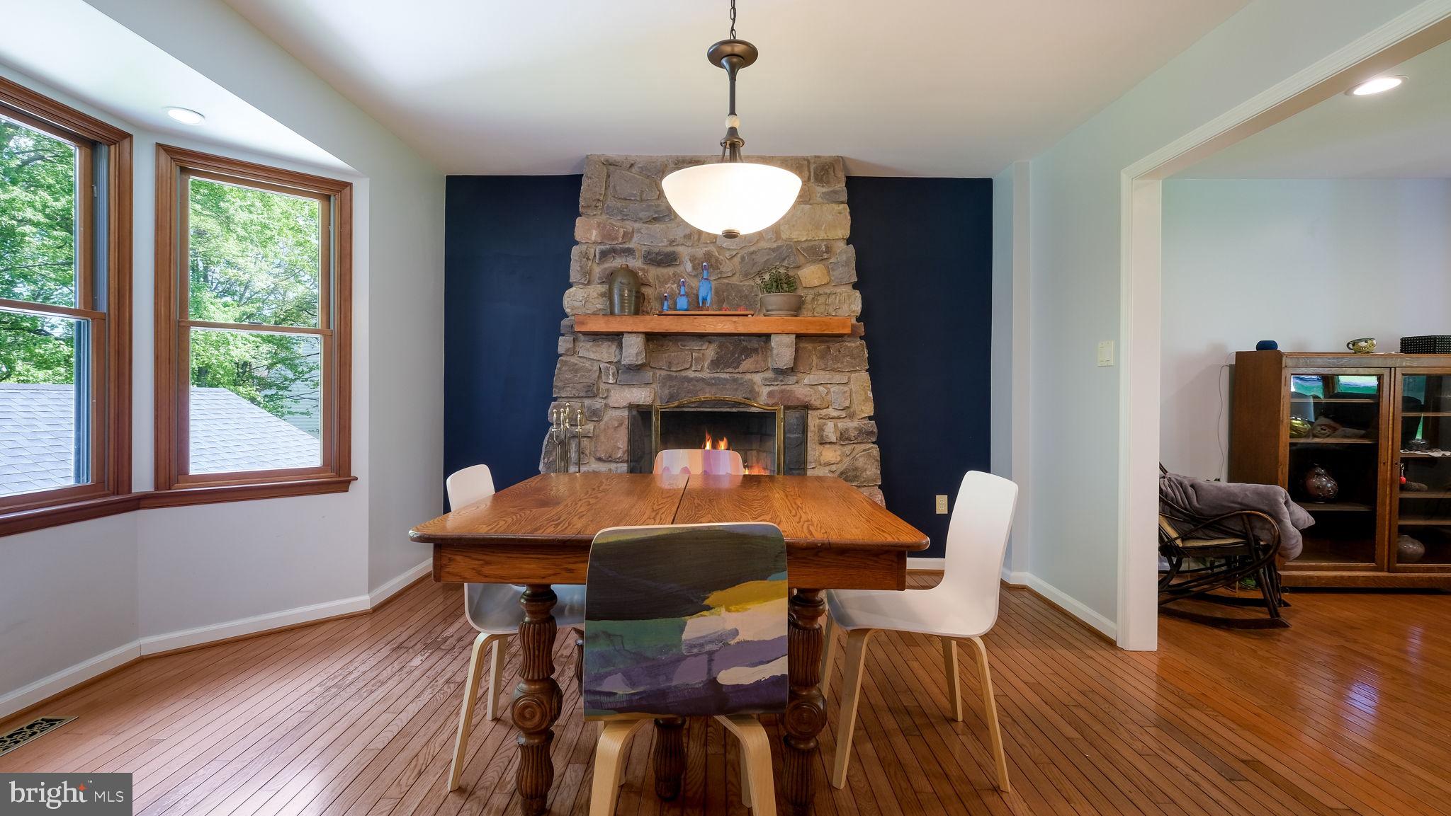 1270 Oxford Valley Road Yardley, PA 19067 - Photo 9 of 39 a dining room with furniture wooden floor a chandelier and a rug