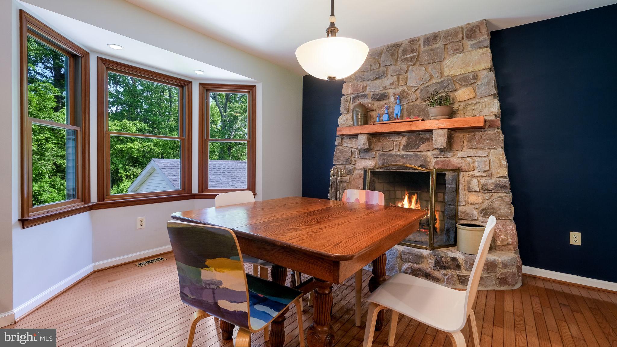 1270 Oxford Valley Road Yardley, PA 19067 - Photo 10 of 39 a dining room with furniture wooden floor a rug a potted plant and a chandelier