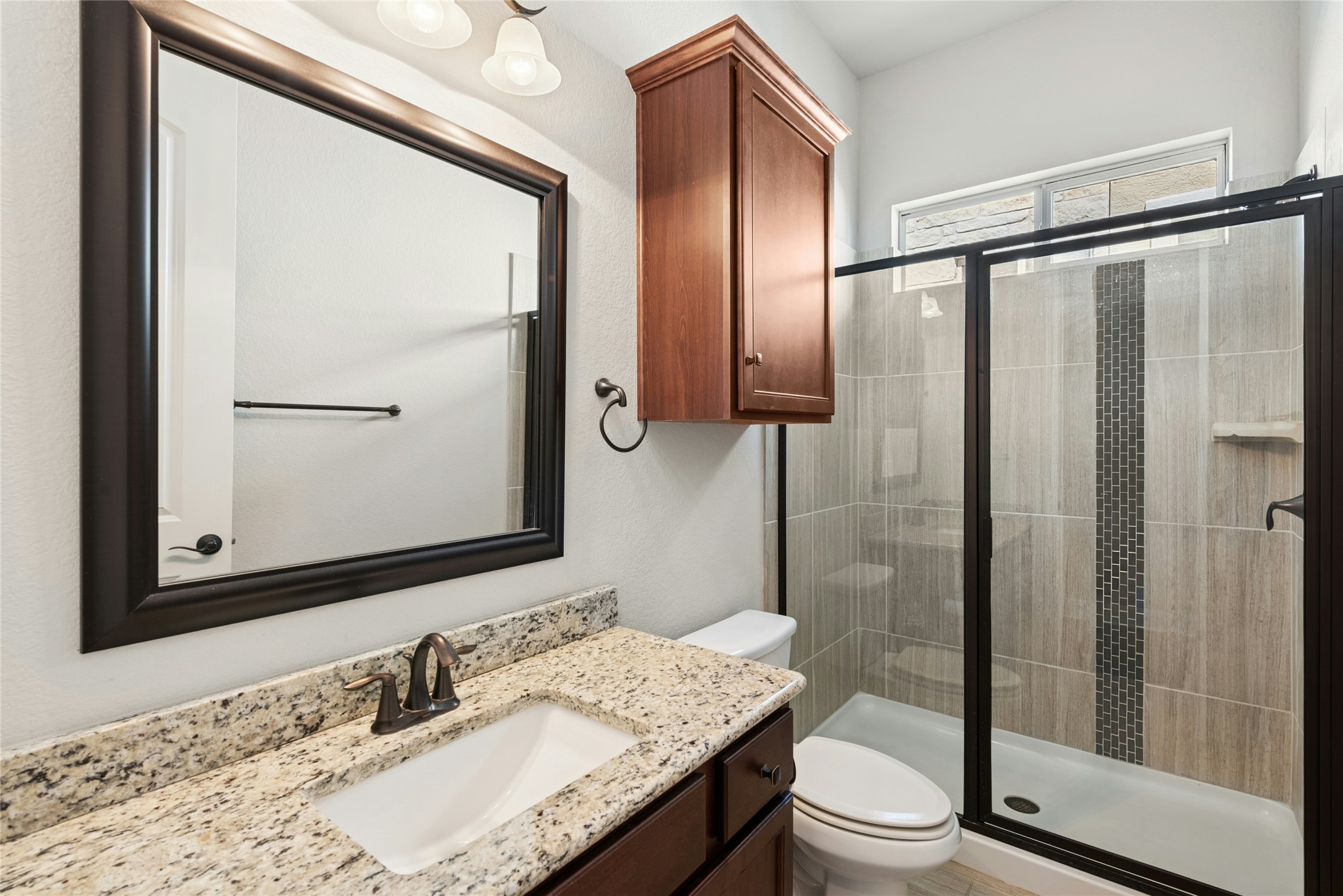 116 Evolutions Path Lakeway, TX 78738 - Photo 24 of 34 Bathroom with a shower stall and vanity