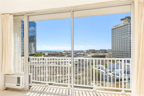 a view of a balcony with wooden floor