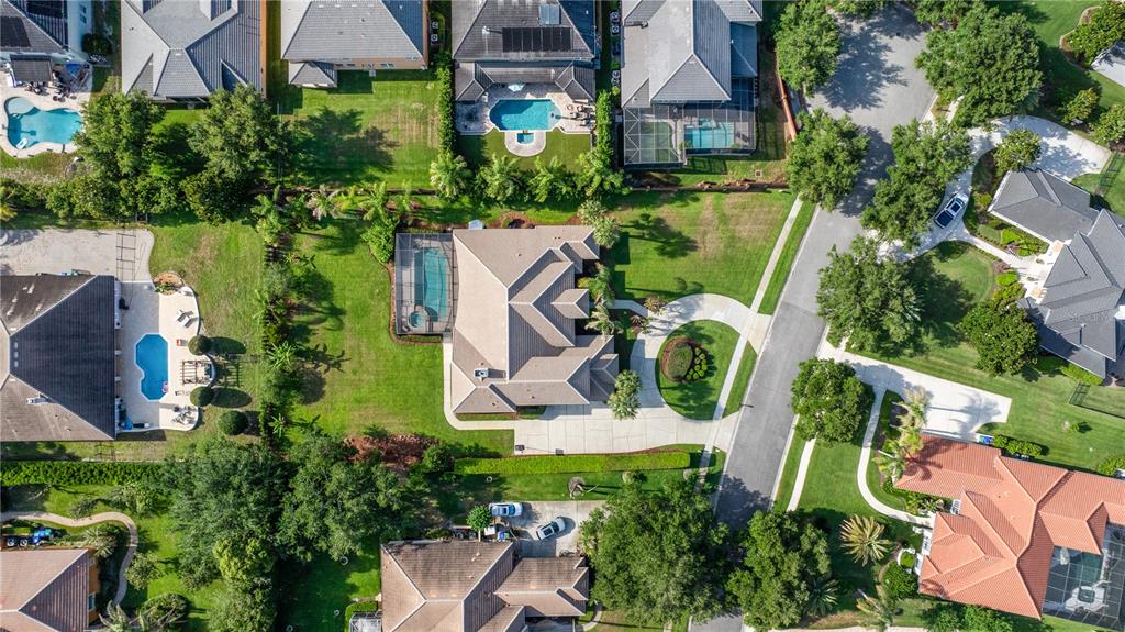 2002 Water Key Drive Windermere, FL 34786 - Photo 48 of 60 an aerial view of a house with garden space and street view