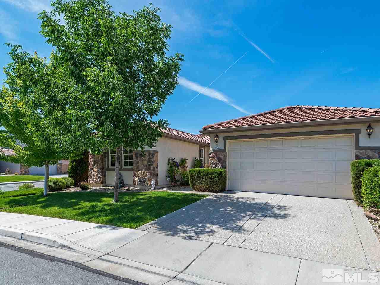 2598 Spring Flower Drive Reno, NV 89521 - Photo 1 of 21 a front view of a house with a yard and potted plants