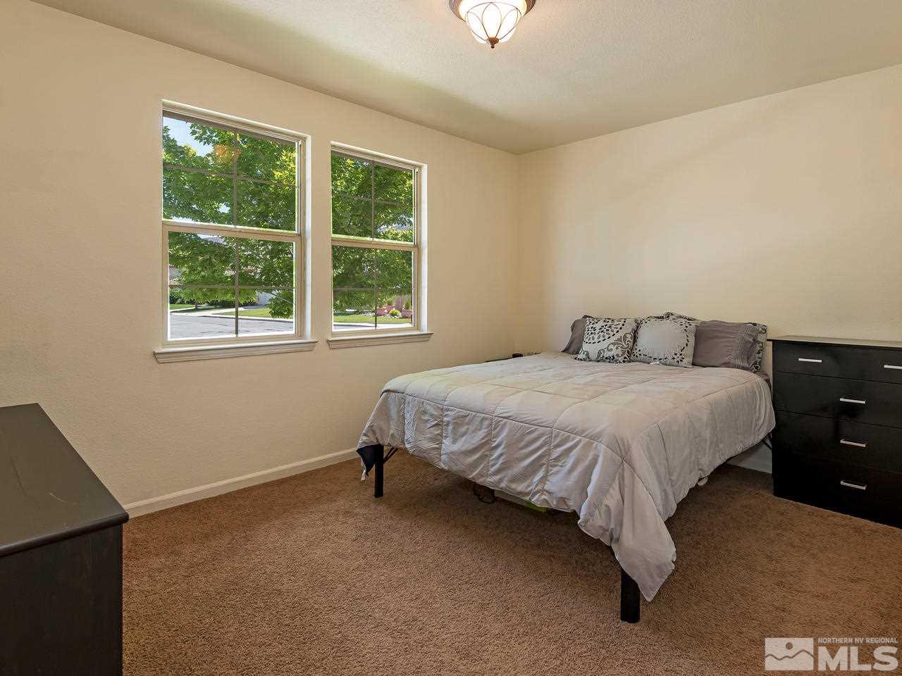 2598 Spring Flower Drive Reno, NV 89521 - Photo 15 of 21 a bedroom with a bed and window