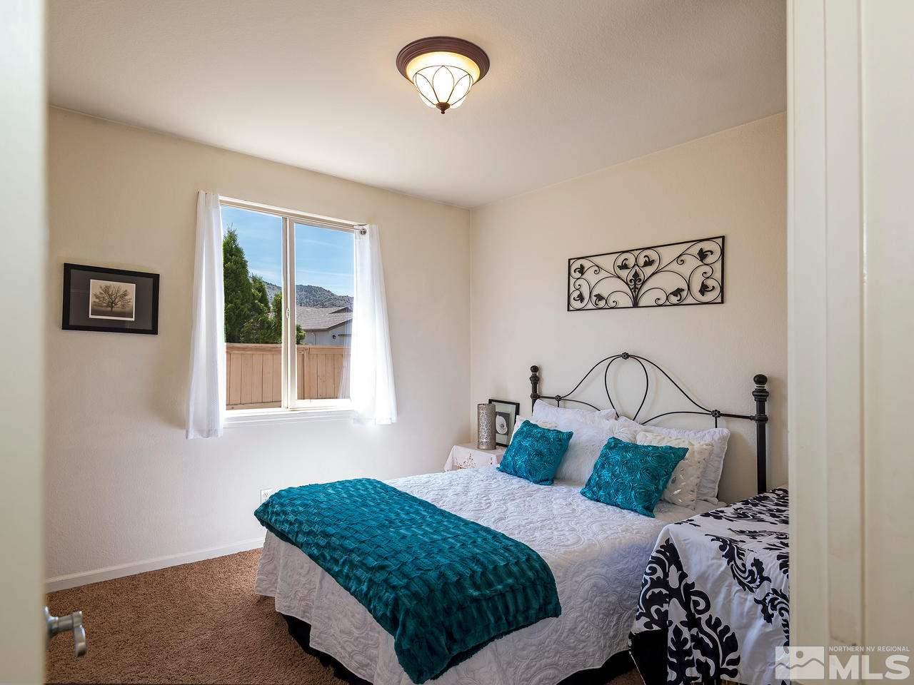 2598 Spring Flower Drive Reno, NV 89521 - Photo 16 of 21 a bedroom with a bed and a window