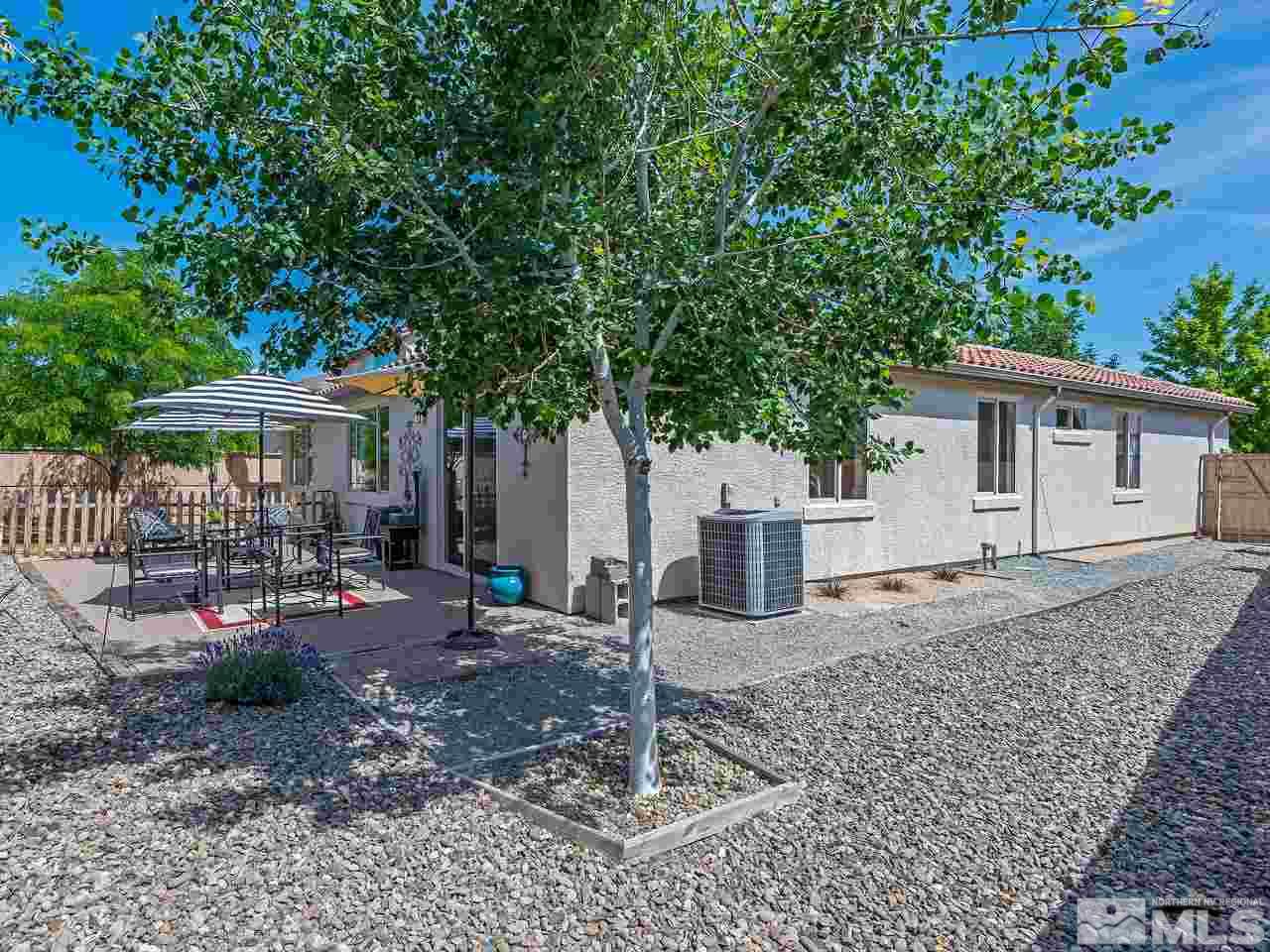 2598 Spring Flower Drive Reno, NV 89521 - Photo 20 of 21 a house with trees in the background