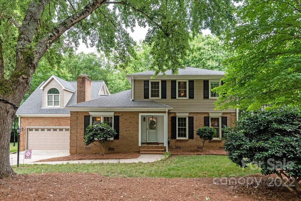 709 Neill Ridge Road Matthews, NC 28105 - Photo 1 of 38 a front view of a house with a yard and potted plants