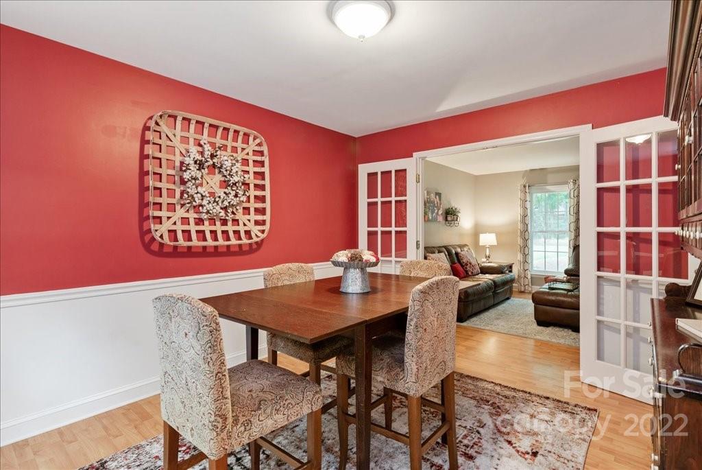 709 Neill Ridge Road Matthews, NC 28105 - Photo 11 of 38 a view of a dining room with furniture and a rug