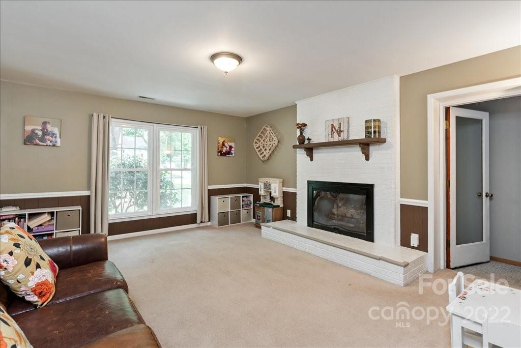 709 Neill Ridge Road Matthews, NC 28105 - Photo 12 of 38 a living room with furniture and a fireplace