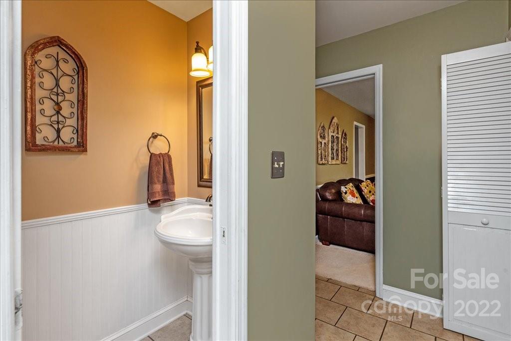709 Neill Ridge Road Matthews, NC 28105 - Photo 18 of 38 a room that has a bed and a mirror in it
