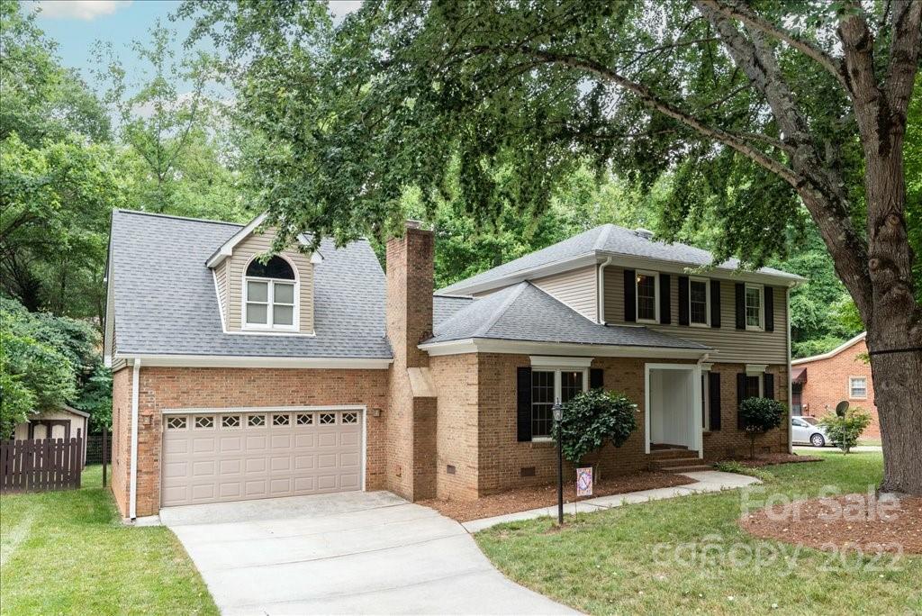 709 Neill Ridge Road Matthews, NC 28105 - Photo 2 of 38 a front view of a house with a yard and table and chairs