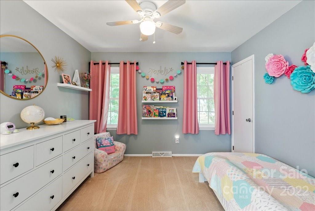 709 Neill Ridge Road Matthews, NC 28105 - Photo 22 of 38 a bedroom with bed and wooden floor
