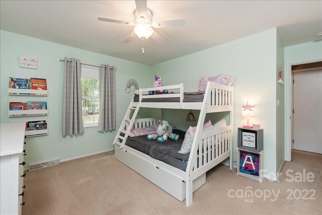 709 Neill Ridge Road Matthews, NC 28105 - Photo 23 of 38 a bedroom with furniture and a baby crib