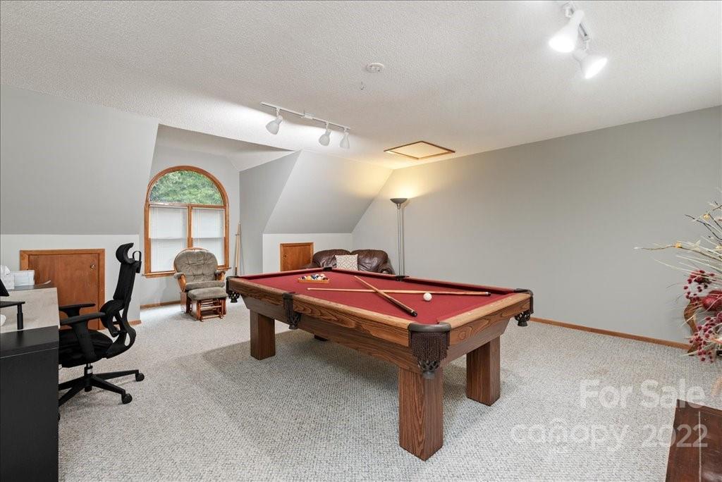 709 Neill Ridge Road Matthews, NC 28105 - Photo 25 of 38 a room with gym equipment pool table and windows