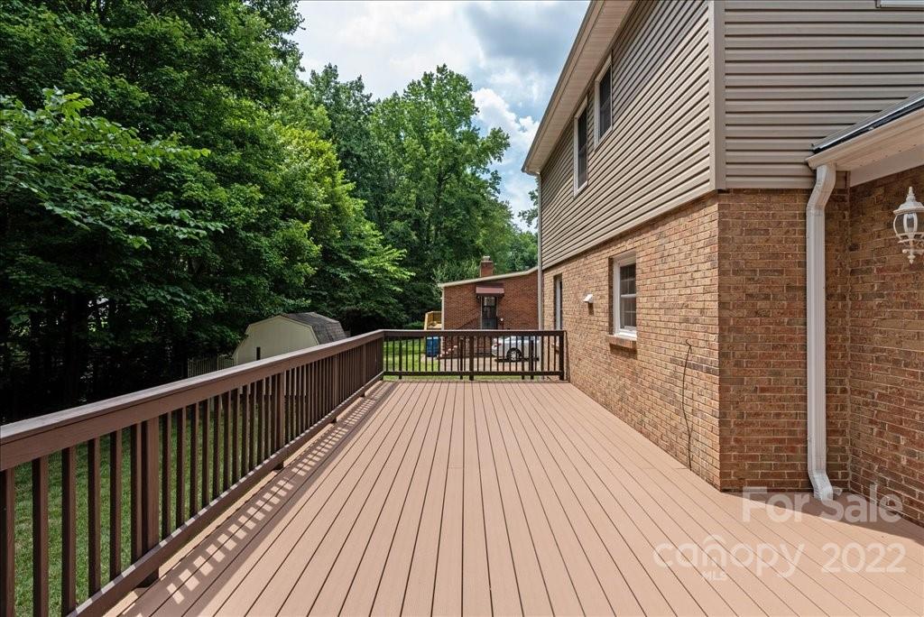 709 Neill Ridge Road Matthews, NC 28105 - Photo 30 of 38 a view of balcony with deck and wooden floor
