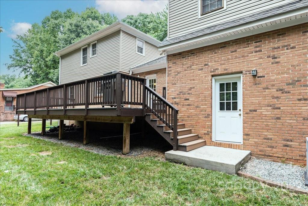 709 Neill Ridge Road Matthews, NC 28105 - Photo 34 of 38 a view of a house with a yard and sitting area