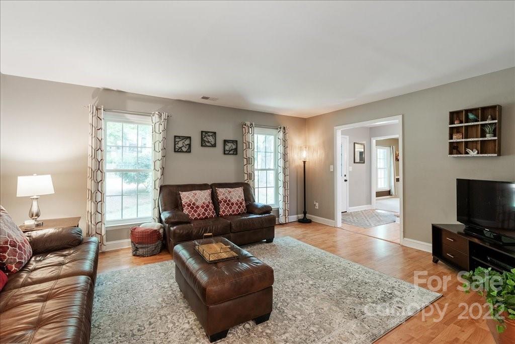 709 Neill Ridge Road Matthews, NC 28105 - Photo 9 of 38 a living room with furniture and a flat screen tv