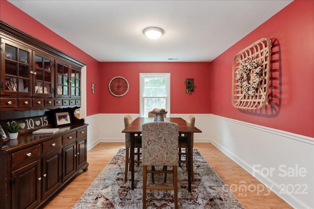 709 Neill Ridge Road Matthews, NC 28105 - Photo 10 of 38 a view of a dining room with furniture