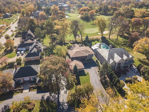 an aerial view of residential houses with outdoor space