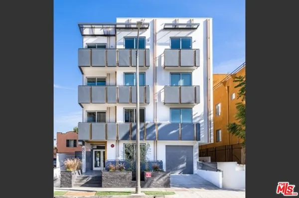 a front view of a building with street view