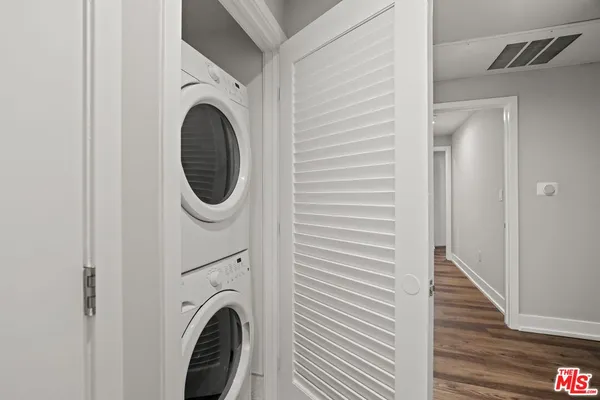 a view of a hallway with washer and dryer