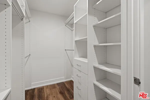 a view of an empty walk in closet