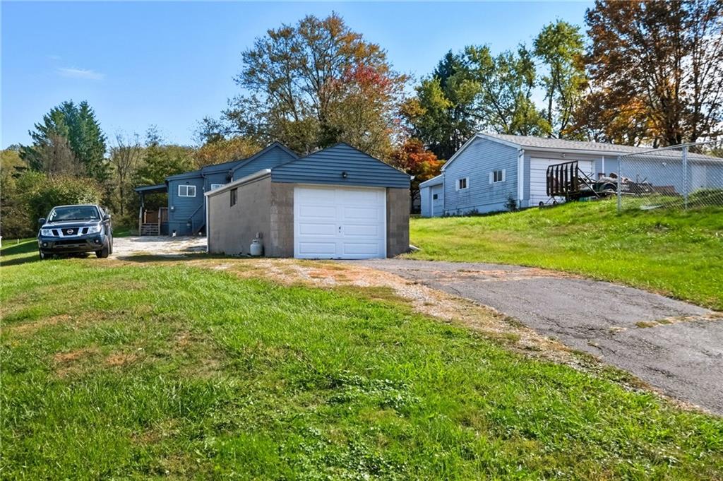 284 West Allegheny Road Imperial, PA 15126 - Photo 15 of 18 a front view of a house with a yard and garage