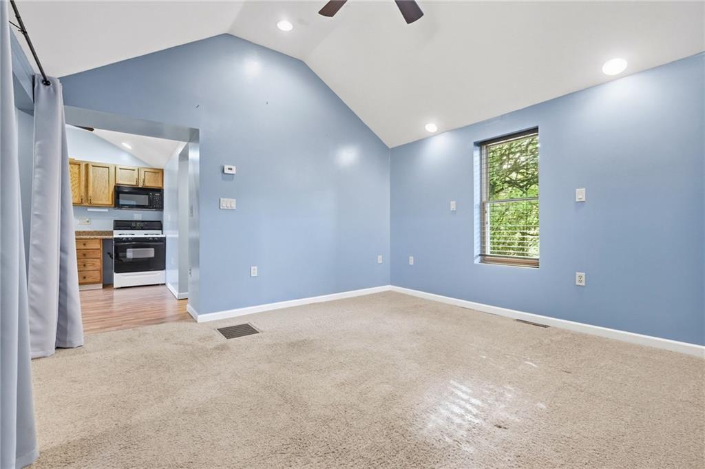 284 West Allegheny Road Imperial, PA 15126 - Photo 3 of 18 an empty room with windows and cabinet