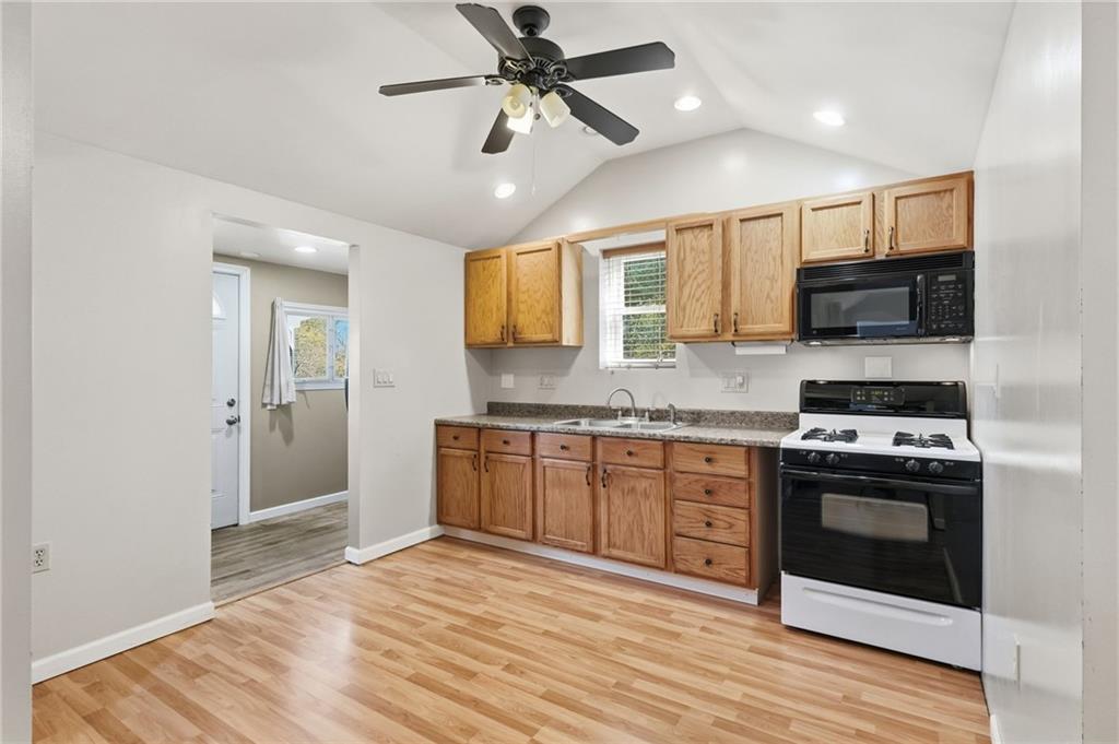 284 West Allegheny Road Imperial, PA 15126 - Photo 9 of 18 a kitchen with stainless steel appliances granite countertop a stove a sink and a refrigerator