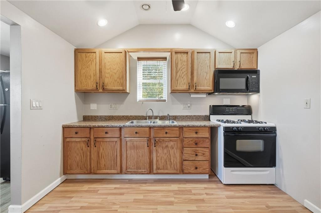 284 West Allegheny Road Imperial, PA 15126 - Photo 10 of 18 a kitchen with stainless steel appliances granite countertop a stove a sink and a microwave