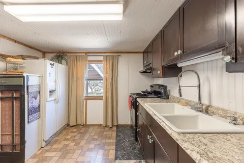 a bed room with furniture and a window