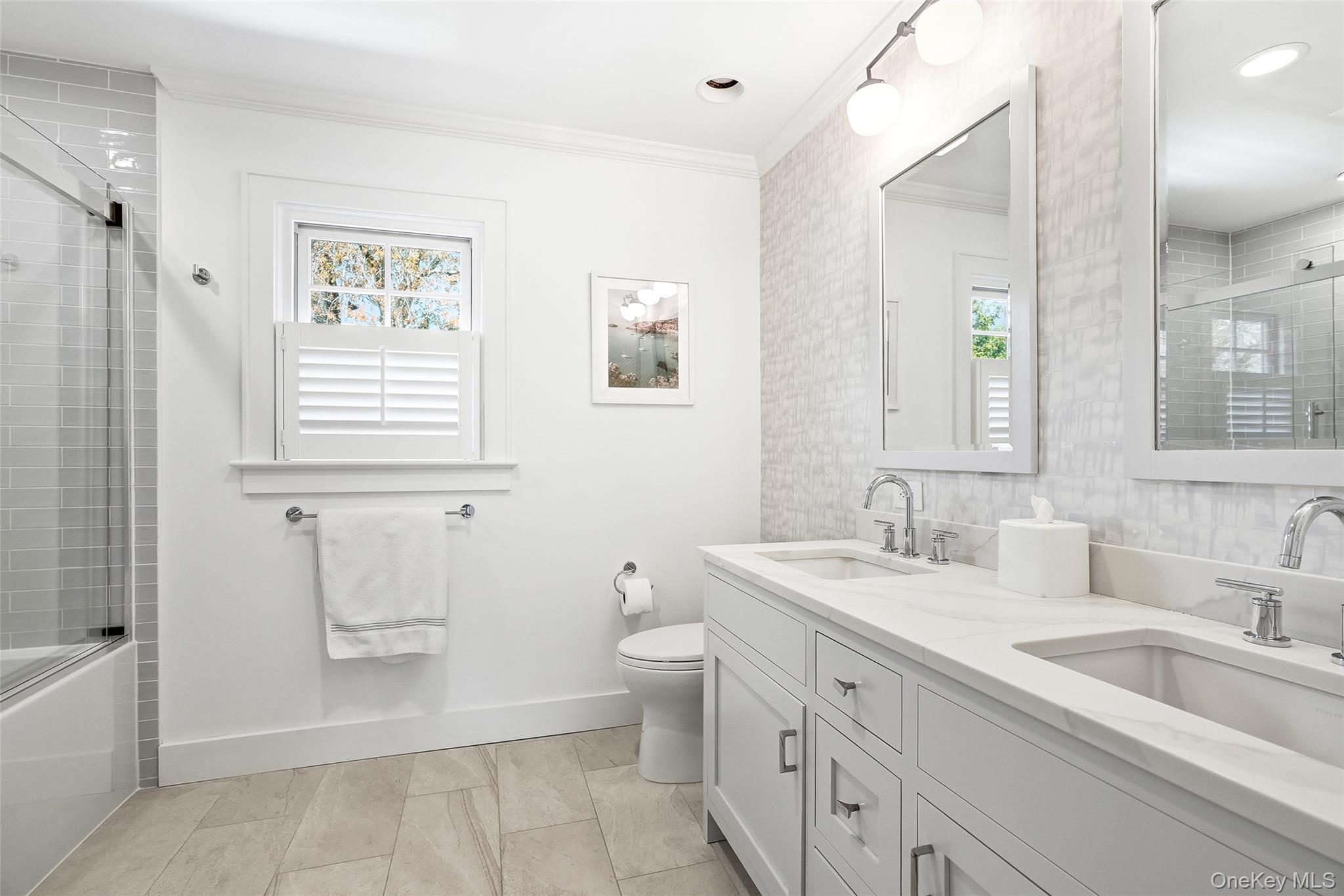 19 Onondaga Street Rye, NY 10580 - Photo 23 of 39 Renovated hall bath with double sinks and tub/shower
