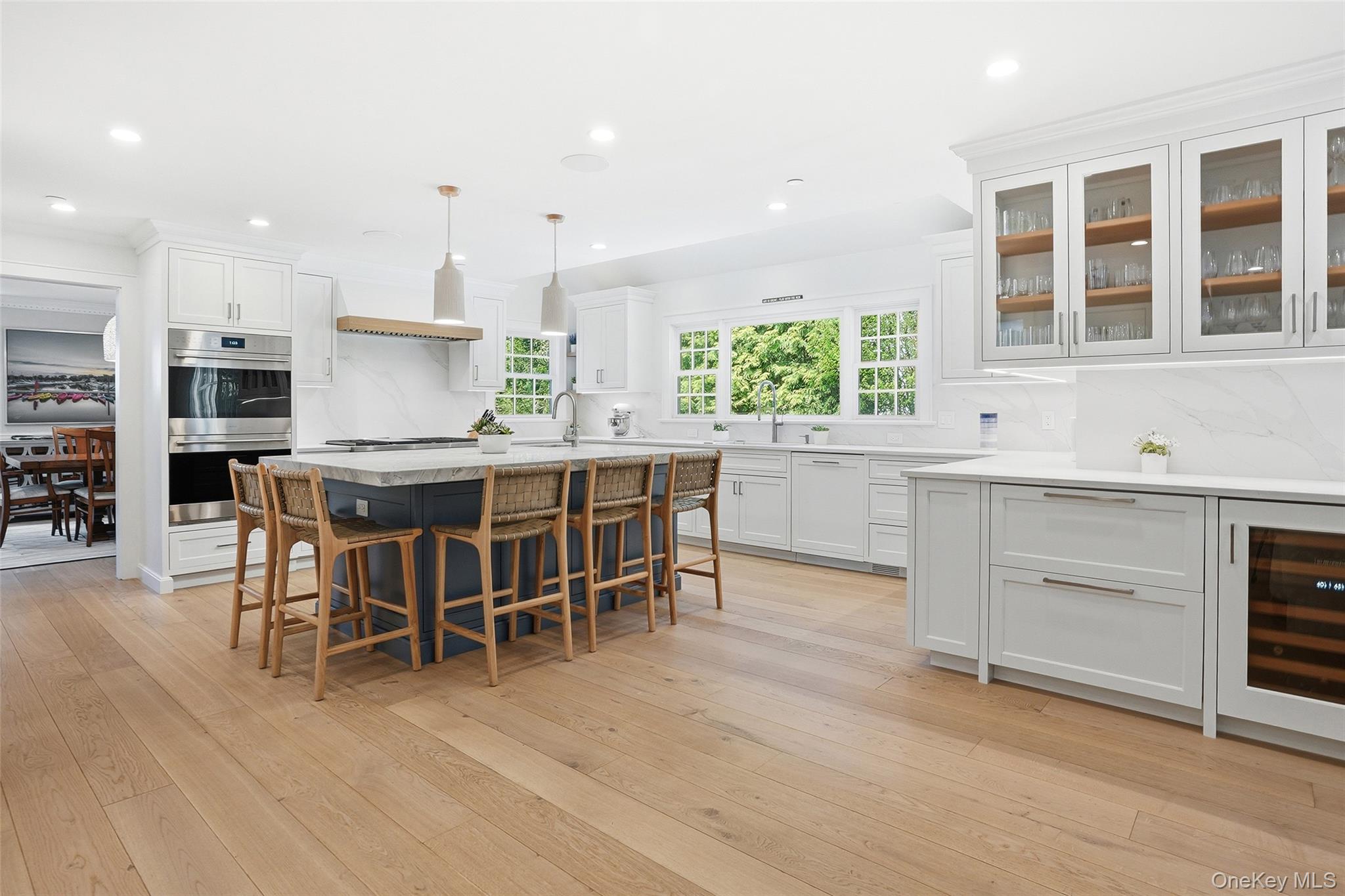 19 Onondaga Street Rye, NY 10580 - Photo 4 of 39 Kitchen with island seating for 5 and refrigerator drawers and wine refrigerator on peninsula leading to Family Room