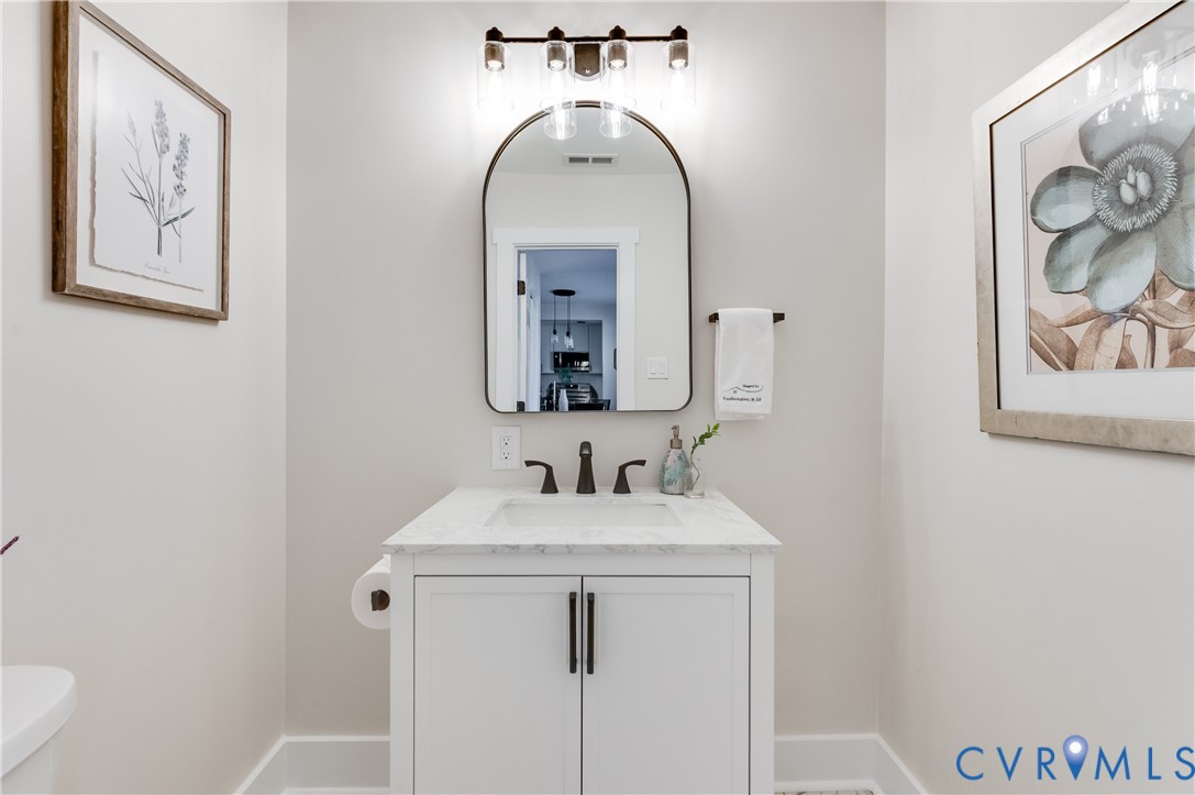 10298 Jamestown Road Ashland, VA 23005 - Photo 25 of 46 a bathroom with a sink and a mirror