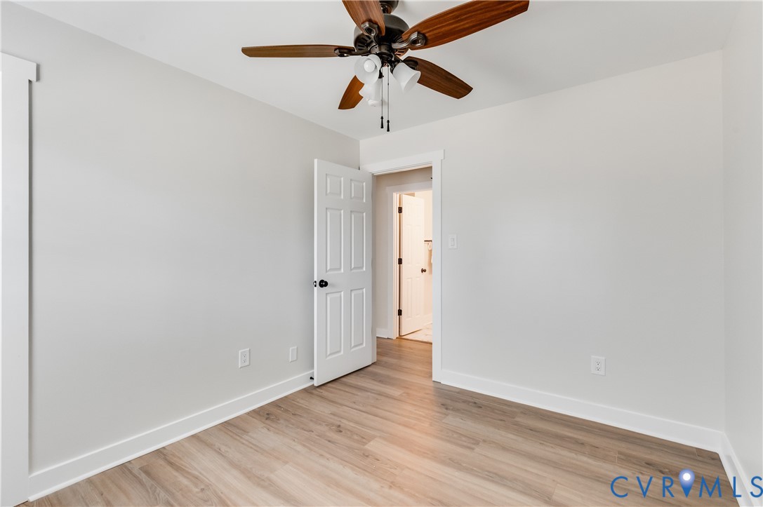 10298 Jamestown Road Ashland, VA 23005 - Photo 29 of 46 a view of hallway with wooden floor and ceiling fan