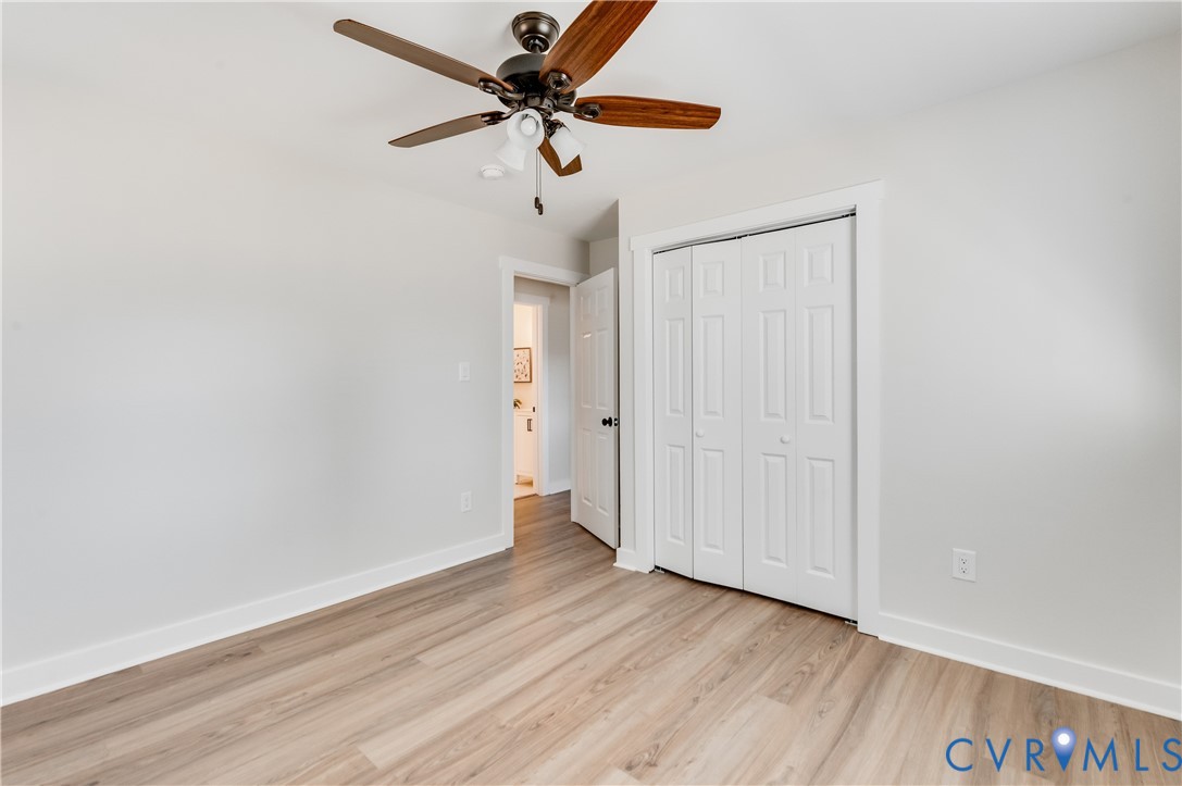10298 Jamestown Road Ashland, VA 23005 - Photo 31 of 46 an empty room with wooden floor and fan