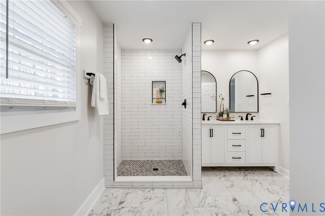 10298 Jamestown Road Ashland, VA 23005 - Photo 38 of 46 a bathroom with a double vanity sink mirror and shower