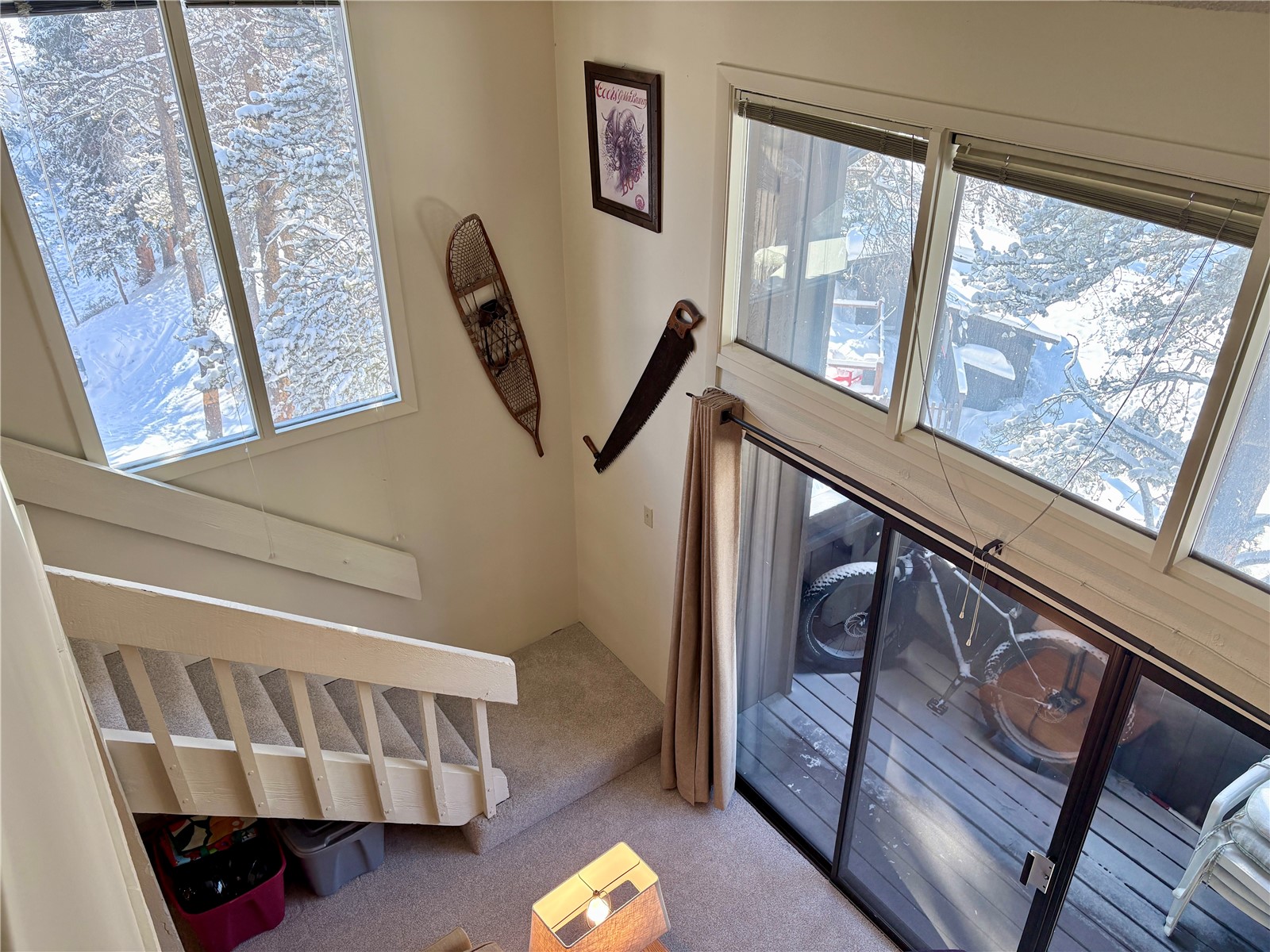 78 Guller Road, Unit 303 Copper Mountain, CO 80443 - Photo 20 of 43 a view of staircase with lots of frames on wall and a window