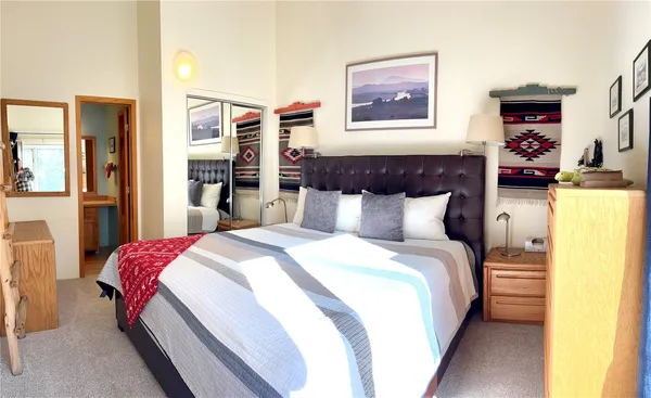 a bedroom with bed and window