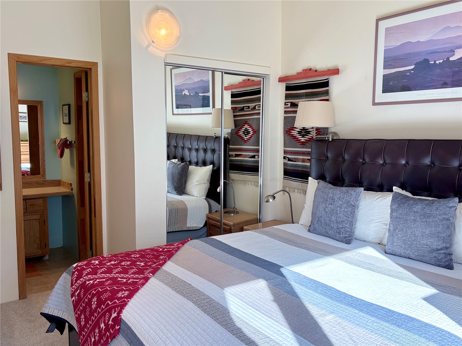 78 Guller Road, Unit 303 Copper Mountain, CO 80443 - Photo 24 of 43 a bedroom with a bed and a chandelier