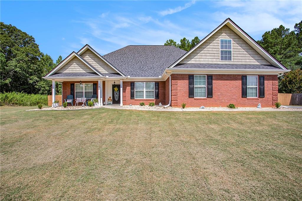 125 Chimney Ridge Lane Covington, GA 30014 - Photo 1 of 1 front view of a house with a yard