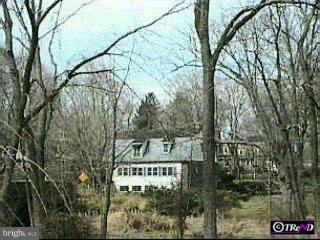 745 Forest Grove Road Furlong, PA 18925 - Photo 1 of 1 a view of a street with sign board
