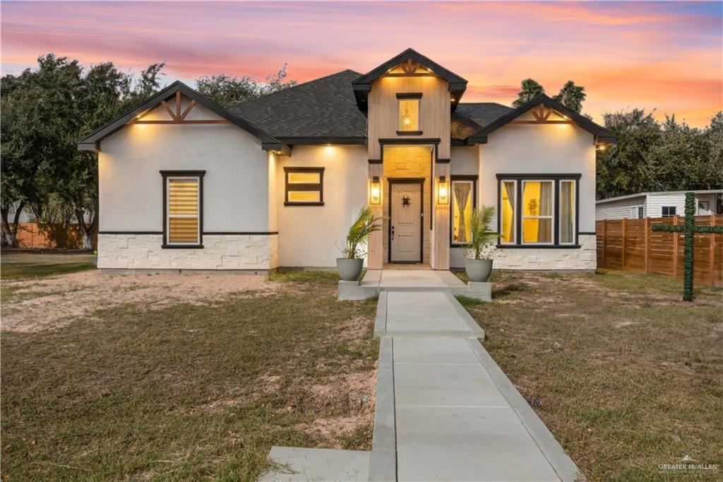 2800 Encke Rd Mission Mission, TX 78574 - Photo 1 of 21 a front view of a house with a yard and garage