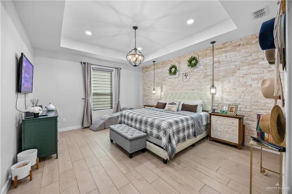2800 Encke Rd Mission Mission, TX 78574 - Photo 12 of 21 a spacious bedroom with a bed dresser and a flat tv screen