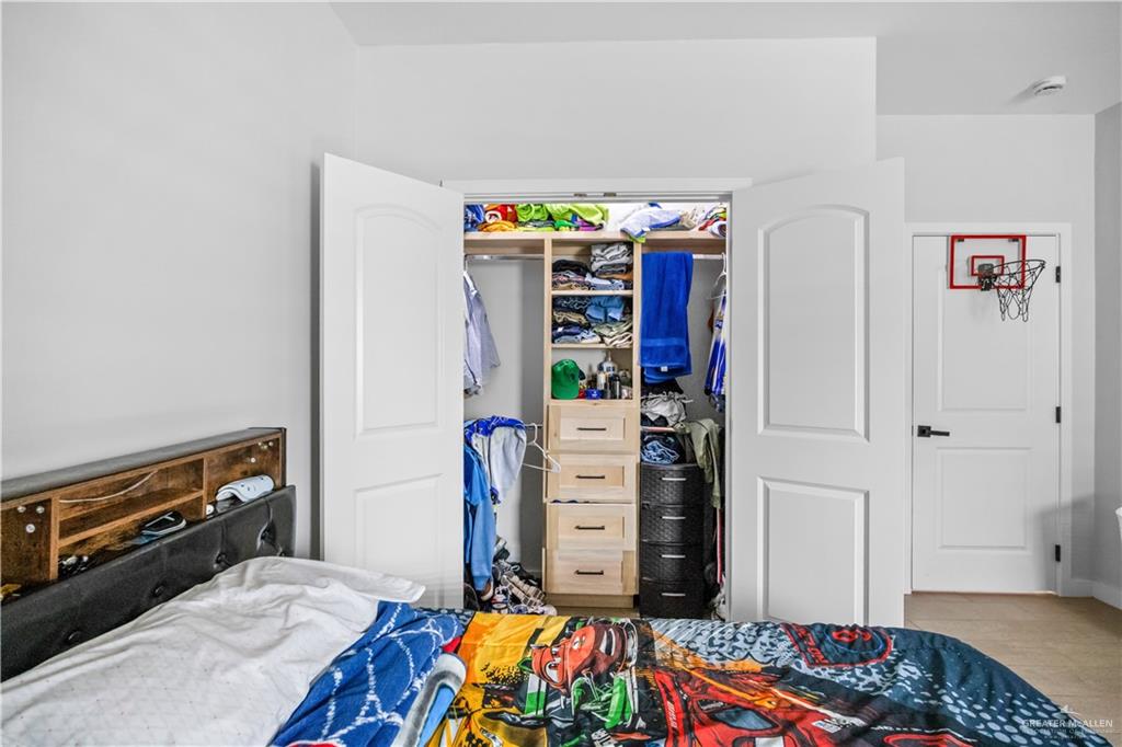 2800 Encke Rd Mission Mission, TX 78574 - Photo 19 of 21 a bed room with a bed and a book shelf