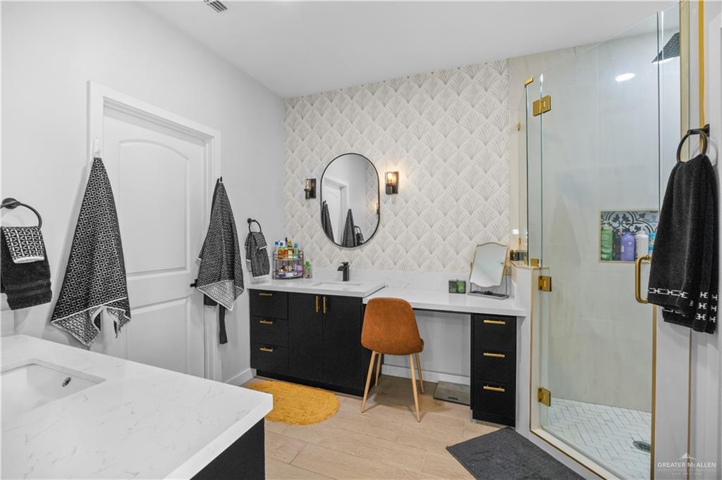 2800 Encke Rd Mission Mission, TX 78574 - Photo 10 of 21 a view of a workspace with furniture and a flat screen tv