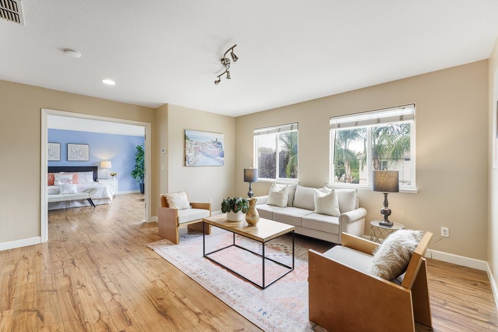 1413 Angus Street Patterson, CA 95363 - Photo 2 of 60 a living room with furniture and a wooden floor