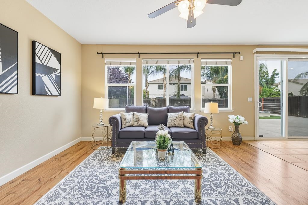 1413 Angus Street Patterson, CA 95363 - Photo 26 of 60 a living room with furniture and a large window
