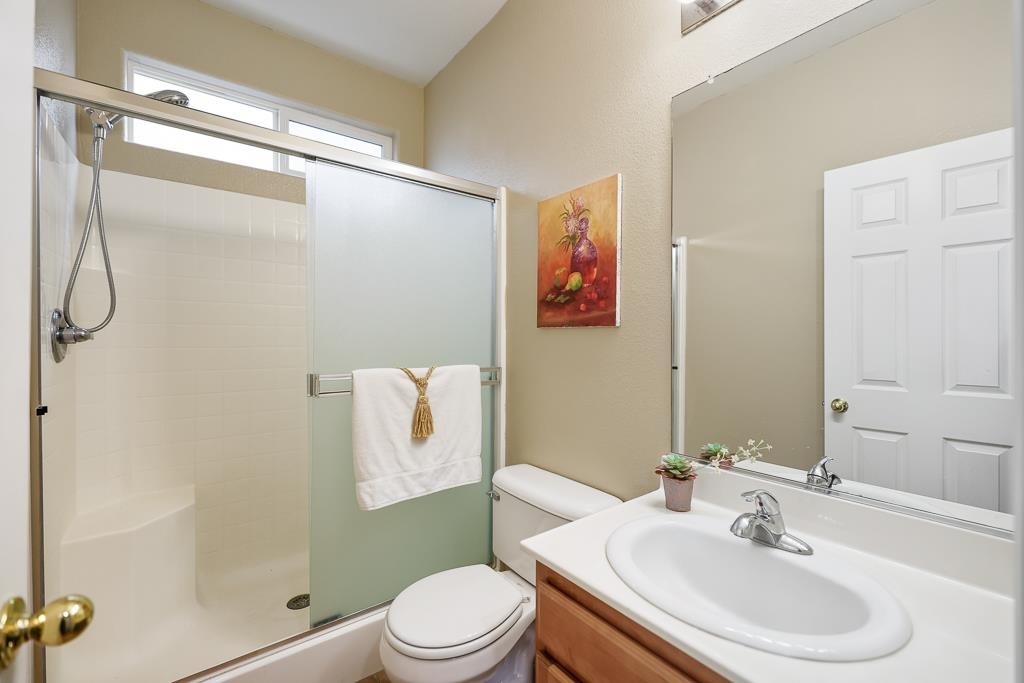 1413 Angus Street Patterson, CA 95363 - Photo 35 of 60 a bathroom with a sink toilet and shower