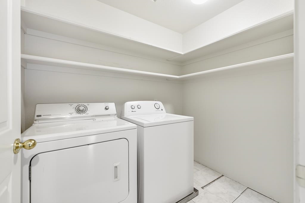 1413 Angus Street Patterson, CA 95363 - Photo 38 of 60 a utility room with dryer and washer