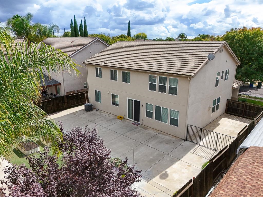 1413 Angus Street Patterson, CA 95363 - Photo 48 of 60 a view of a house with backyard and sitting area
